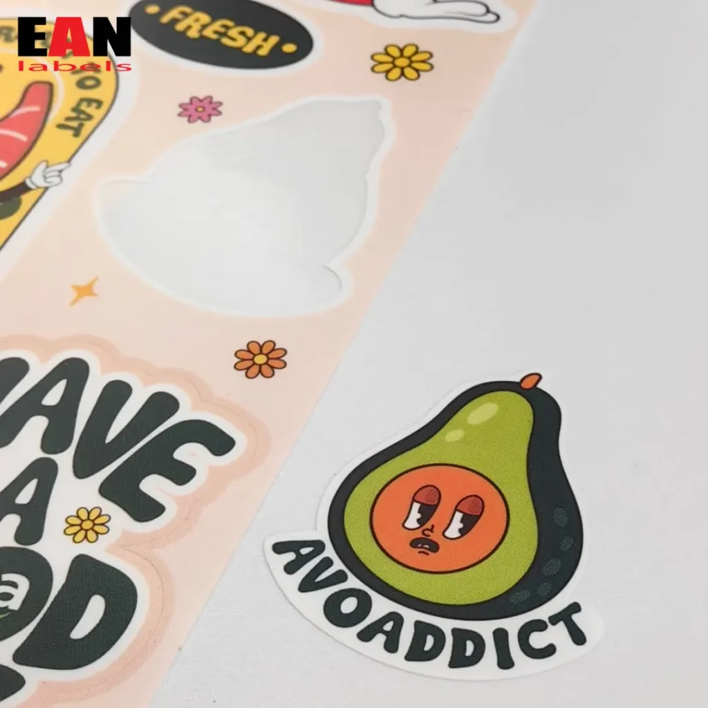 Ean Label printing and packaging manufacturer and supplier in Malaysia, producing kiss-cut stickers showcasing close up view of peeled sticker with illustrations of avocado's cartoon.