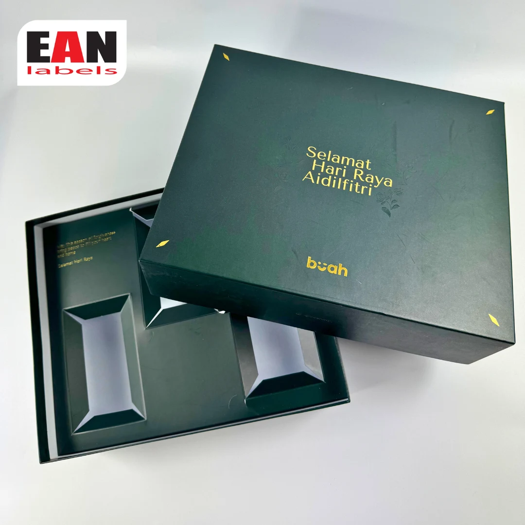 Premium dark green Hari Raya gift box with gold foil printing and custom internal compartments