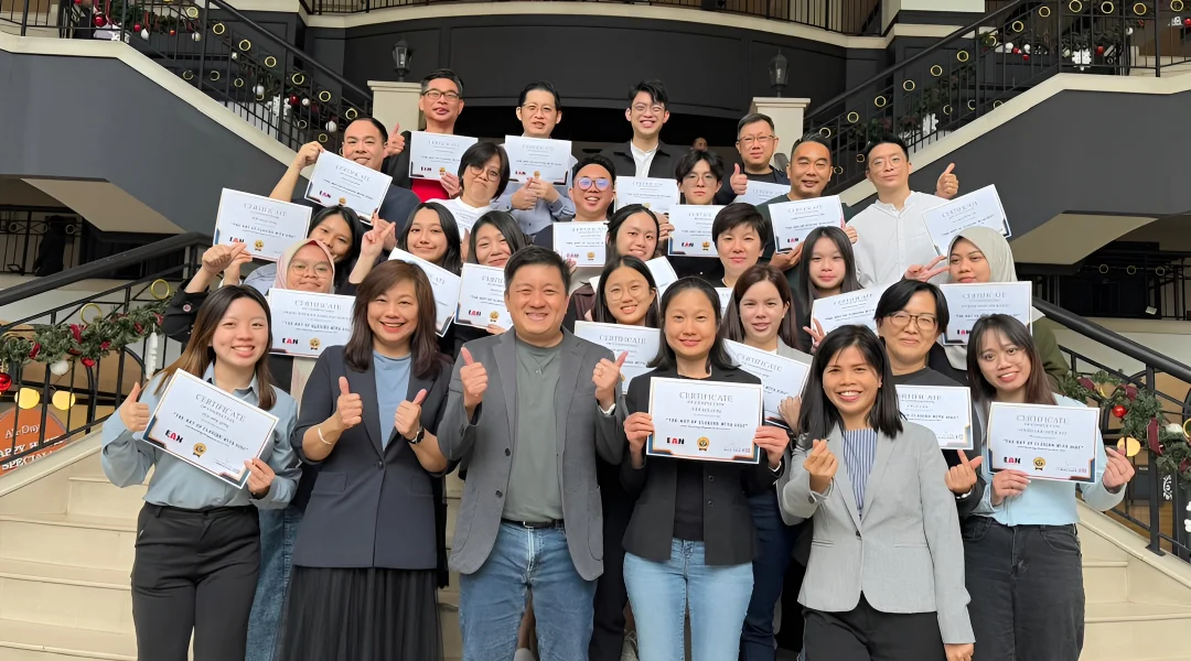 EAN Label employees receiving certificates after a team training and development program in Malaysia