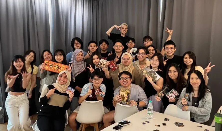EAN Label employees participating in a team building board game activity in Malaysia