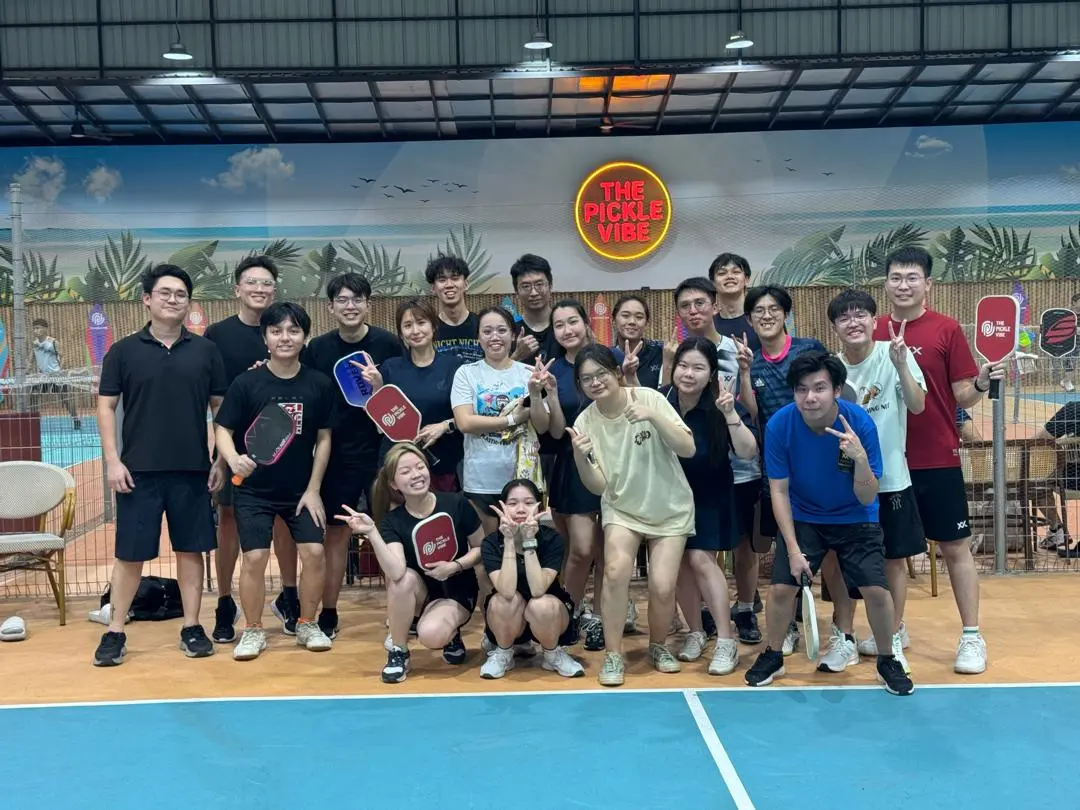 EAN Label employees taking part in a team building pickleball activity in Malaysia