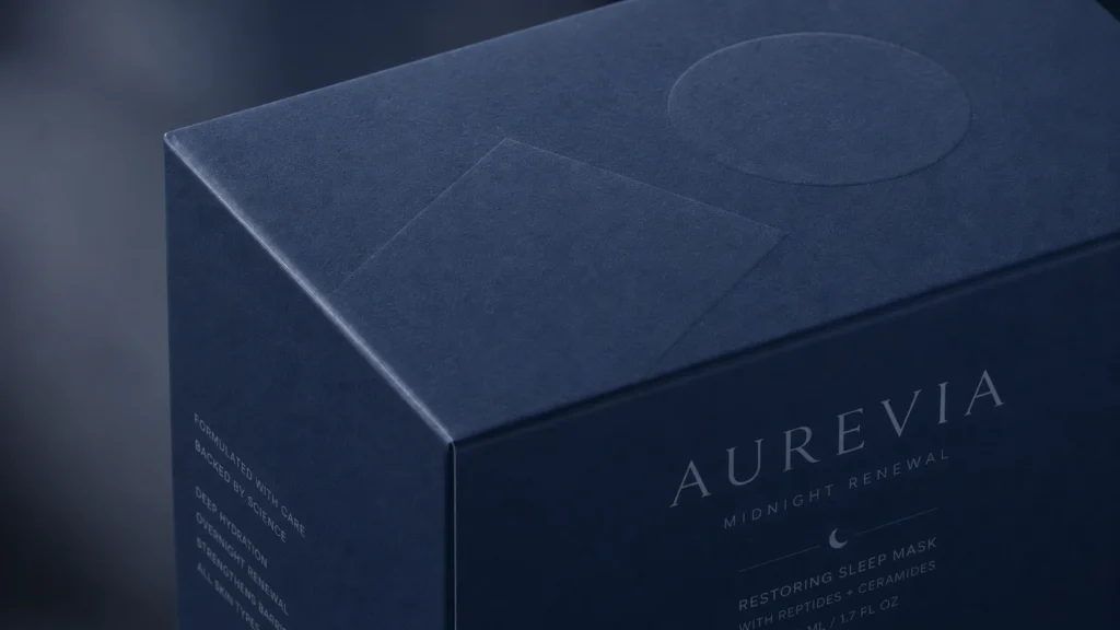 Close-up of dark blue packaging showing a smooth, low-shine Soft Touch finishing texture.